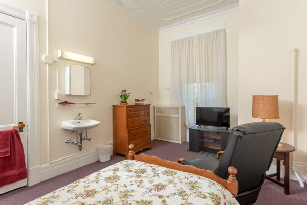 Interior of bedroom at Vassar Warner Home