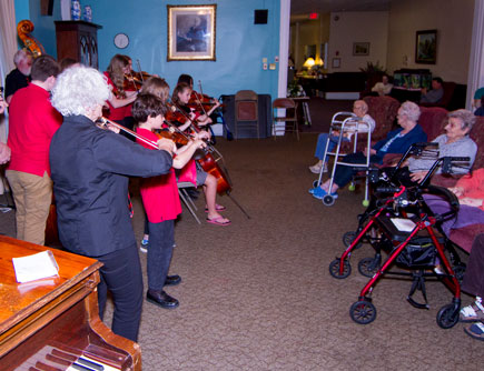 orchestra playing for residents